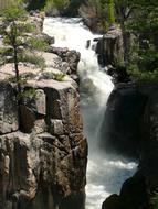 waterfall with rocks and trees