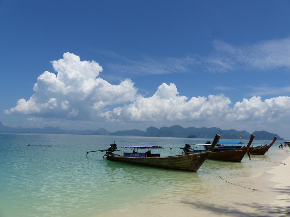 wooden boats on the ocean beach