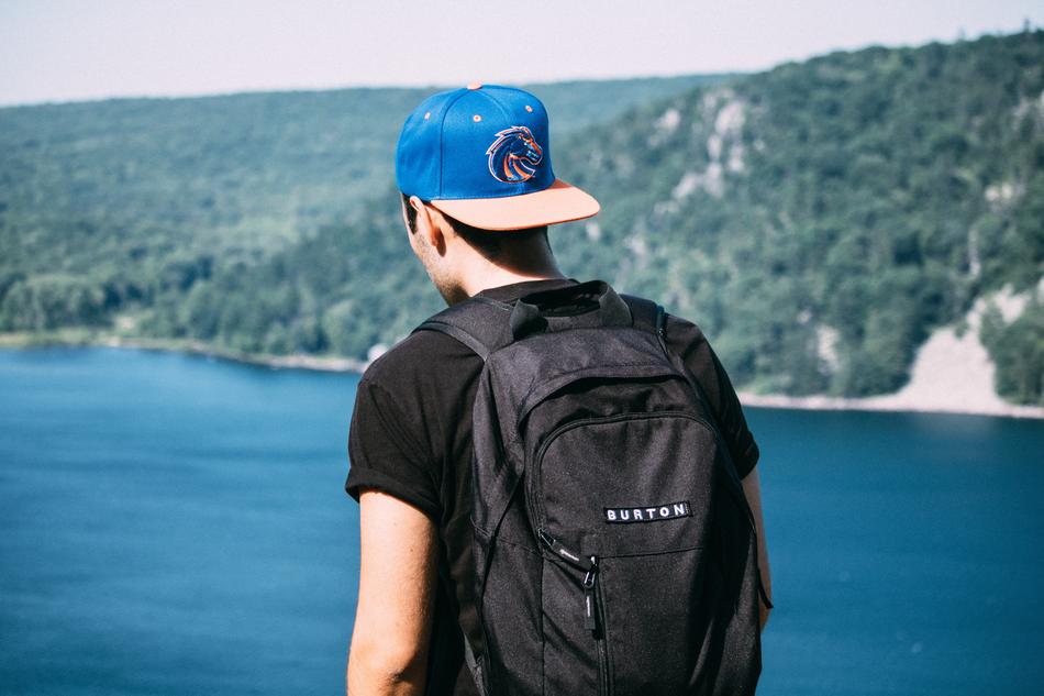 man with a backpack and a hat