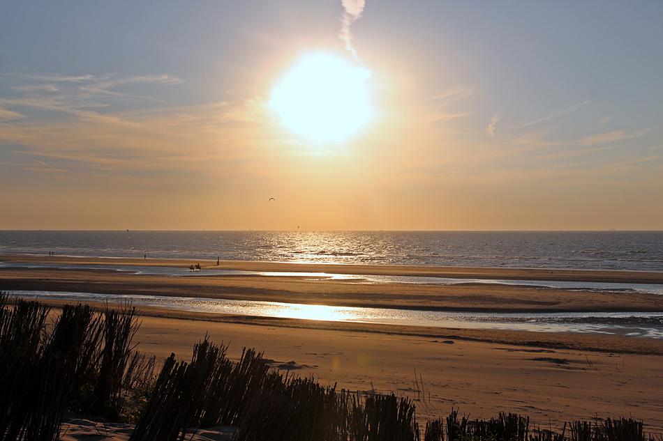 burning sun in the sky over the beach