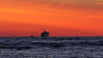 Resort ship in the sea against the background of the sunset