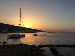 boat at sea at a beautiful sunset