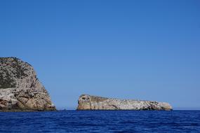 high cliffs in the blue sea