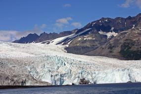 mountain peak with a white snow beach