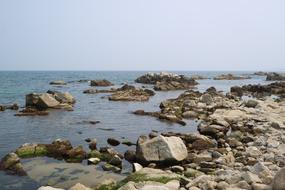 the stone beach with the sea is beautiful