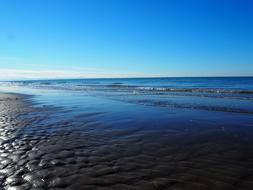 blue sea near the stone beach