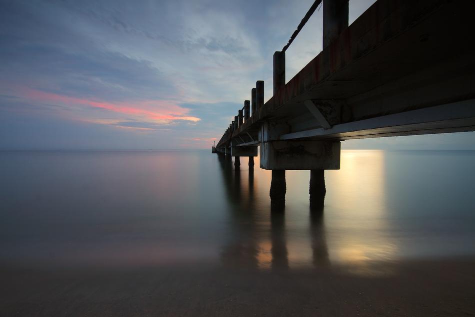 wooden bridge spanning the sea