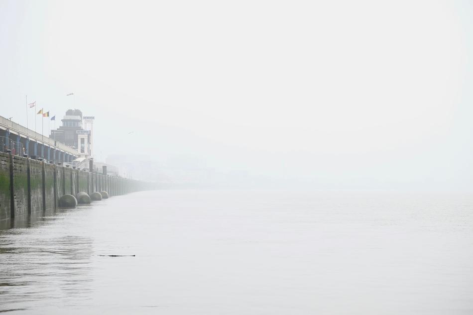 dense fog over the sea by the bridge