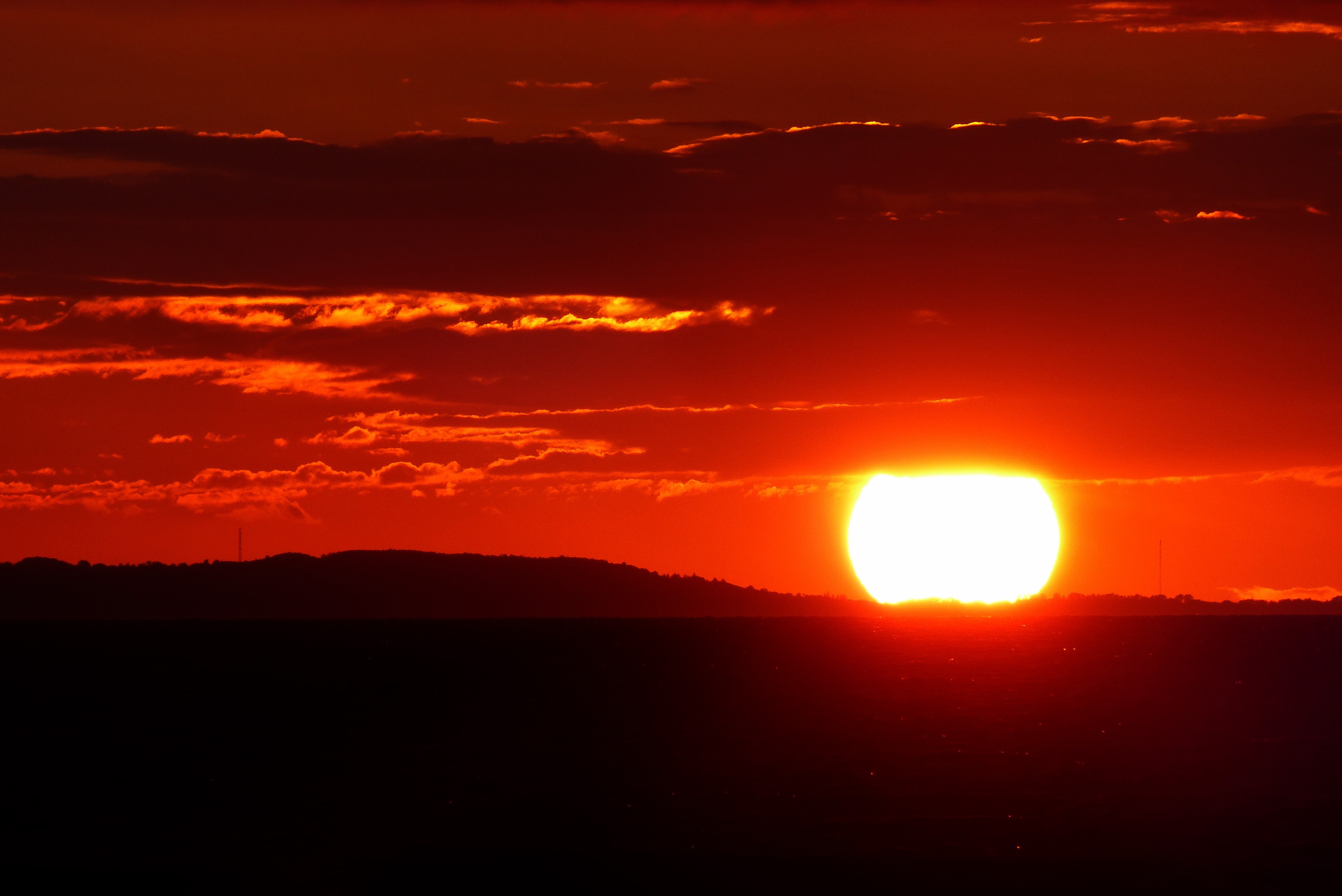 Glowing sun in red sky, scenic Sunset free image download