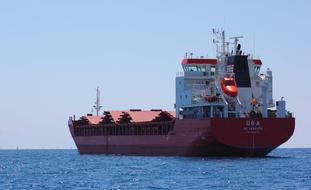 floating cargo ship at sea