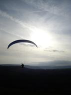 a man on a parachute silhouette