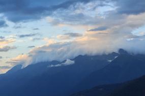 fluffy clouds over the mountains