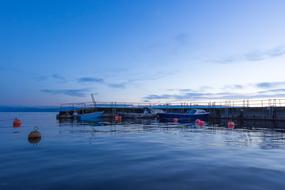 blue hour over pier on lake constance