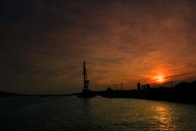 Construction crane at sunset