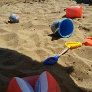 colorful children toys on sand Beach