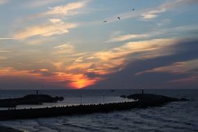 sunset sea clouds mountains