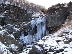 frozen Waterfall on rock, russia, kamchatka
