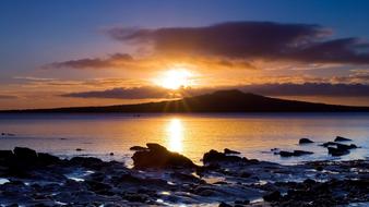 The sun illuminating the sea