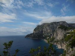 sea mountain mountain clouds view