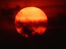 The red sun in the clouds