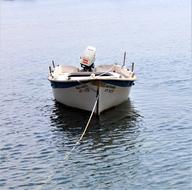 moored white motor Boat on water