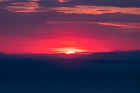 dramatic red Clouds in Sky at Sunset