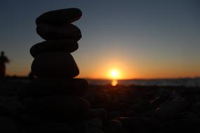 cairn silhouette at Sunset sky