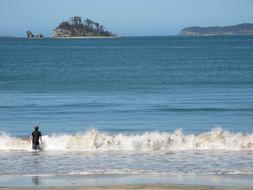 A man in the waves of the sea