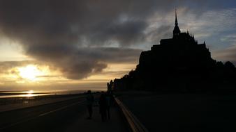 sun clouds silhouette city