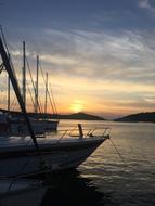 In front of the boat against the sunset