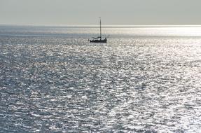 floating boat in the distance