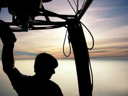 silhouette of a man with cables