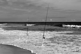 Fishing Poles on empty Ocean Beach