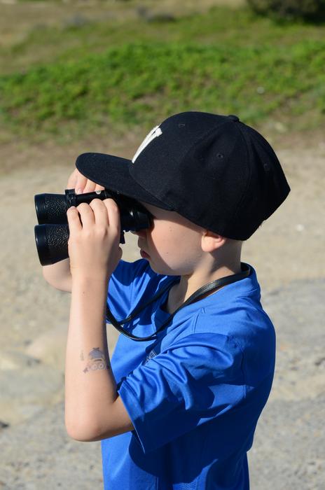 a child with binoculars