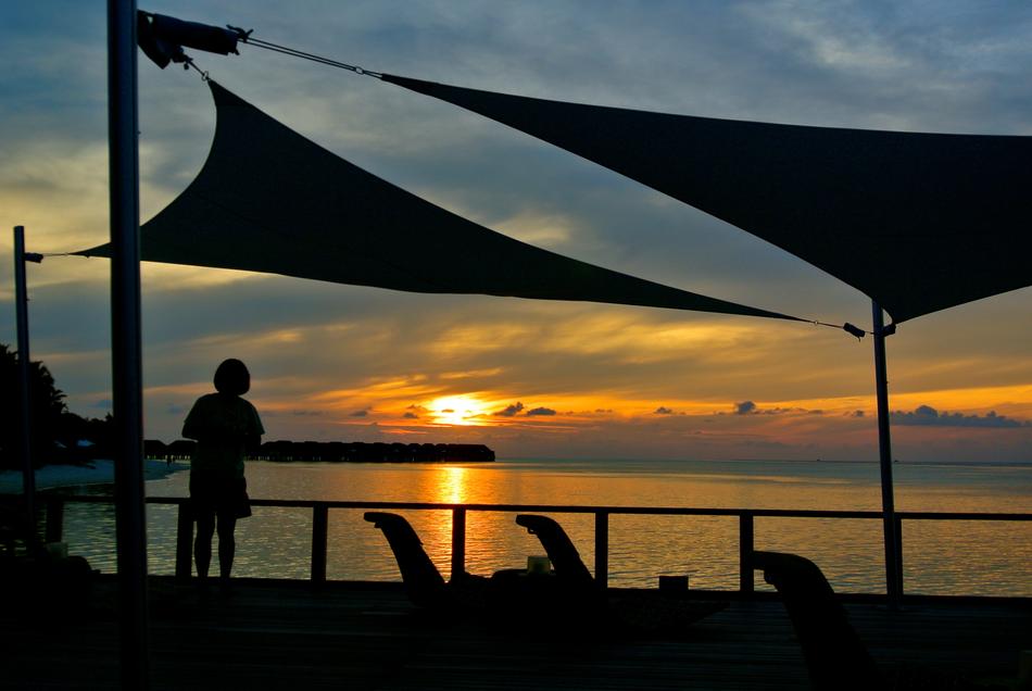 silhouette of a man against the sea
