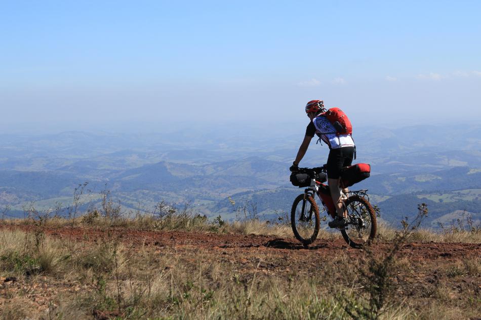 man on bicycle on a cliff