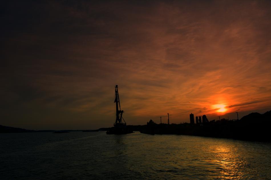 Construction crane at sunset