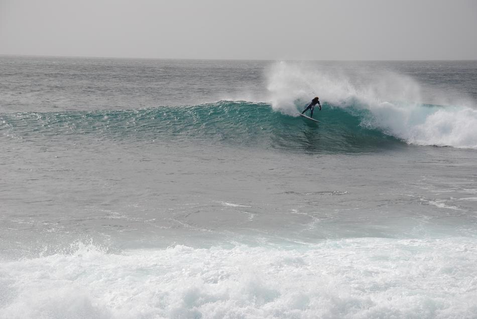 A man surfs the waves in the sea