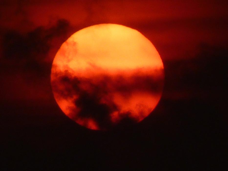 The red sun in the clouds