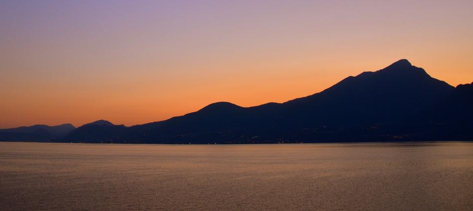 Silhouette of a mountain against the sunset