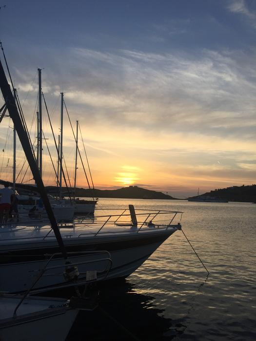In front of the boat against the sunset