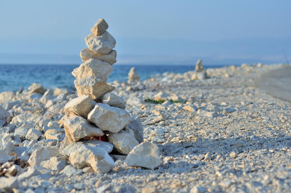stone zen tower on the beach