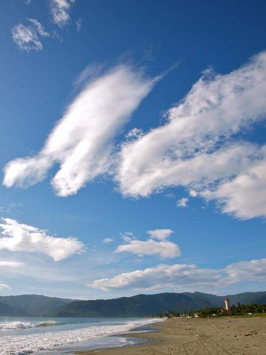 white clouds over the sea beach