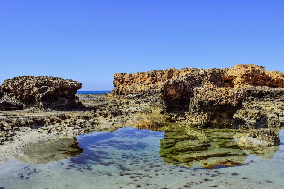 rocky cliffs with moss in the sea