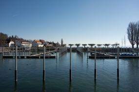 iron pipes with a house on the wharf
