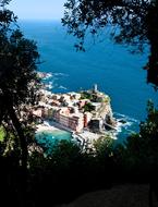 tower in village on cliff at sea, italy, Cinque Terra, vernazza