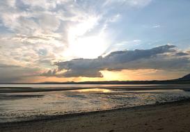 sunrise with clouds by the sea