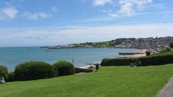 seas with a green field nearby