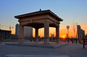 large arch with the sun