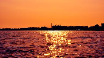 sunset by the sea surface